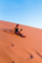 Mother and son sand boarding at Coral Pink Sand Dunes