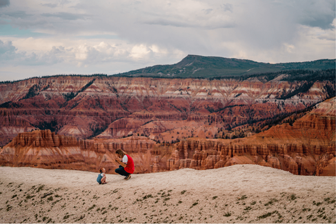 Father and girl hiking red rock at Cedar Breaks National Monument
