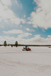 Boy snowmobiling in Duck Creek Utah