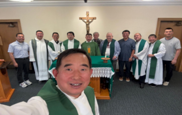 Priests gathered after celebrating Mass during the pilgrimage.