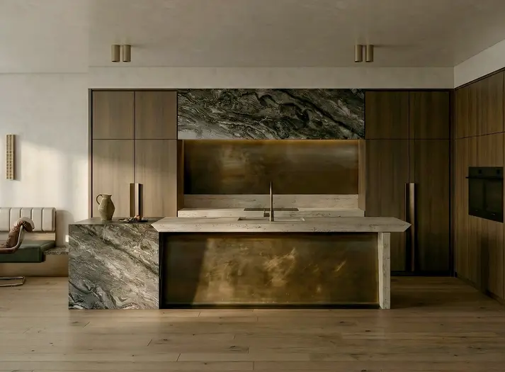 Kitchen with stone island, timber cabinetry and aged brass panels in New Farm Brisbane.