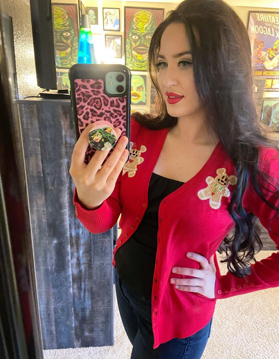 Kailey shows off a Disney Gingerbread Sweater