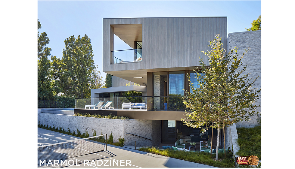 Bedroom with top to bottom windows and glass doors accessing the outdoor patio.