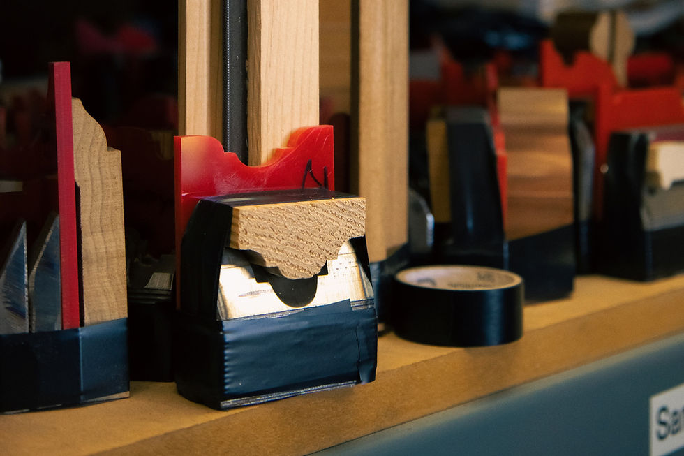 Steel and plastic moulds holing wood moulding for manufacturing.