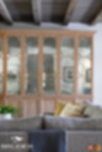 Large TV cabinet hiding all TV hardware, showcasing the framework over mirror panels.