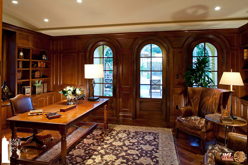 Dark wood office space highlighting the moulding details on the walls.