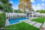 View of backyard, pool, and covered lounge areas.
