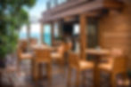 Restaurant outdoor dining area all made of wood overlooking ocean view.