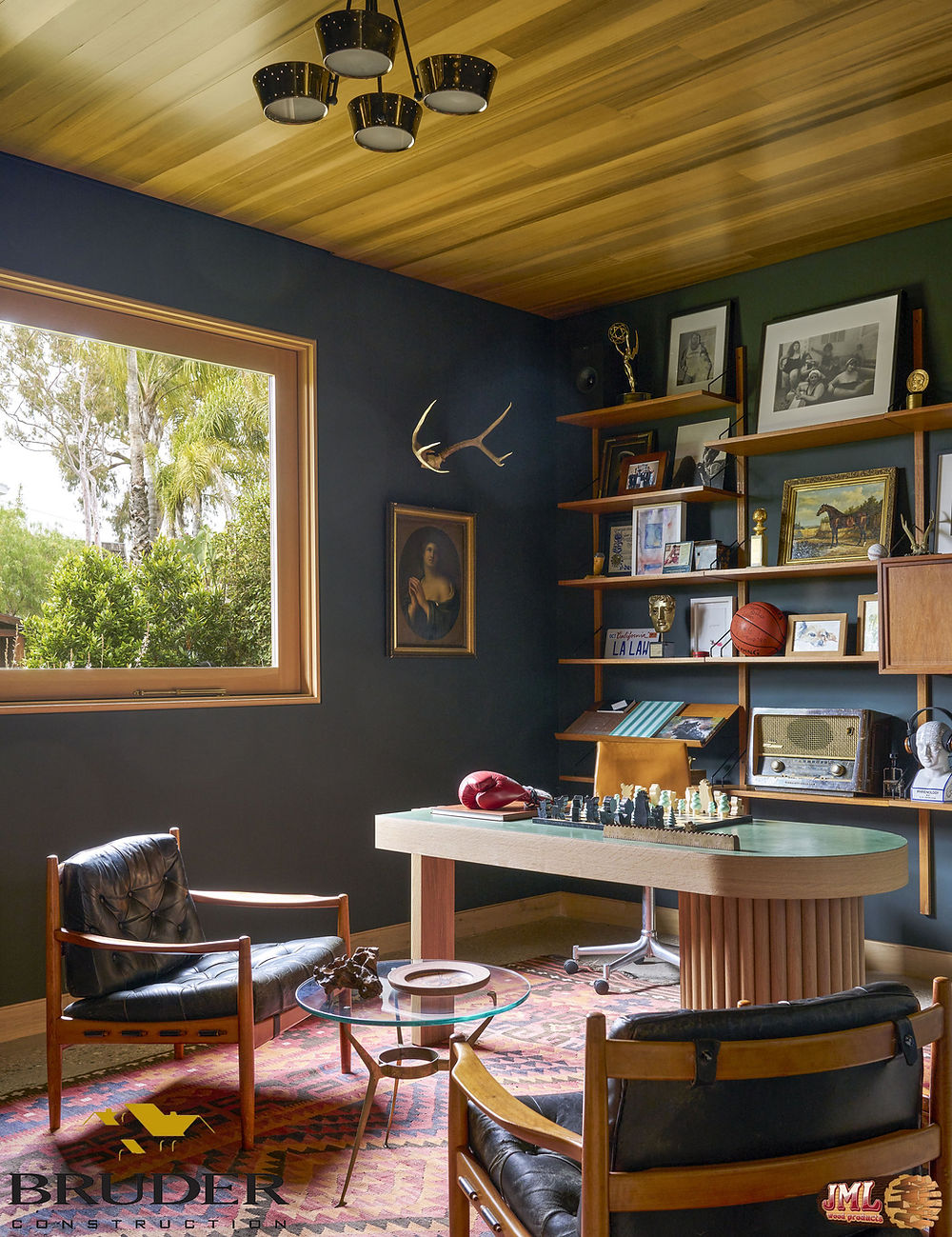 Office with wood ceiling and black leather chairs bringing an overall dark atmosphere.