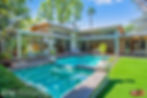 Contemporary home area and backyard in daylight.