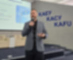 Sean leading a training seminar in a large lecture hall at Kazakh-American Free University (KAFU) in Oskemen, Kazakhstan