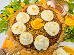 An innovative twist on classic pecan pie! This Sun-Kissed Almond Date Pie features rich date syrup, slivered almonds, and a citrus-mascarpone whipped cream.