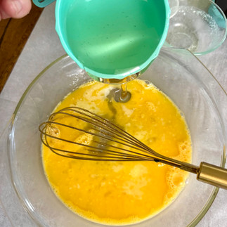 The beaten eggs are mixed with melted butter & corn syrup.