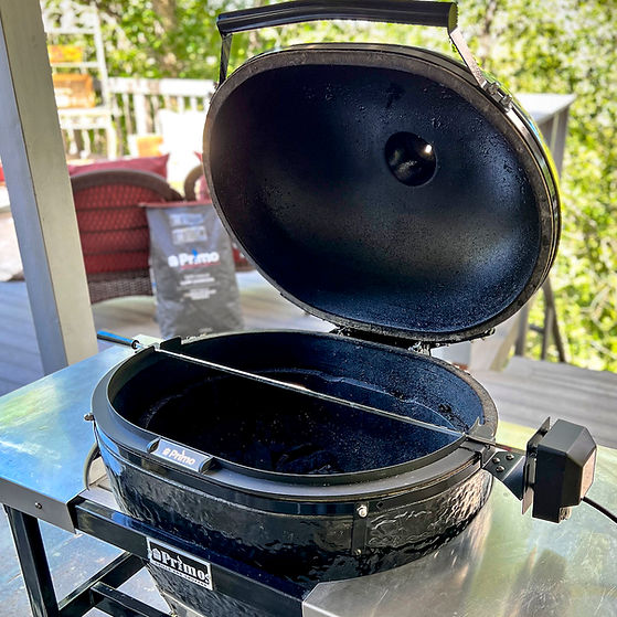 Primo Grill's Rotisserie Kit has been mounted to a Primo Ceramic Grill.
