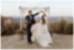 Mountaintop Bride and Groom Portraits in front of Wedding Arch