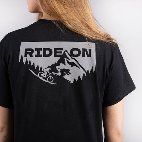 Skier and mountain biker on a t-shirt design with mountain
