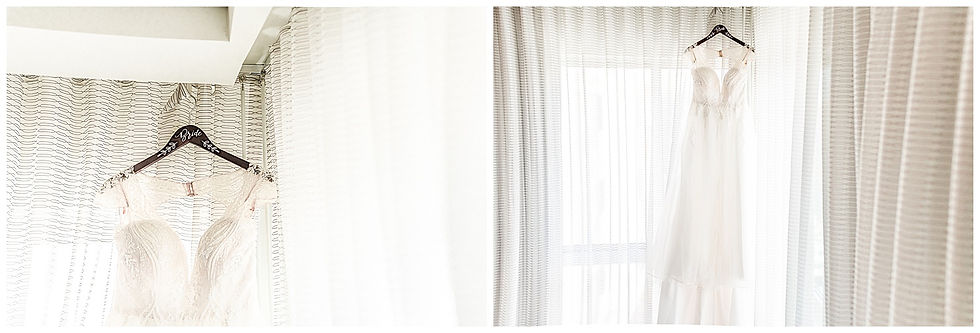 Wedding dress hanging on hotel window with personalized hanger