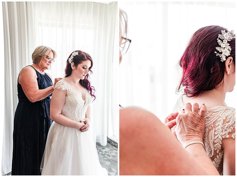 Mother of the bride putting dress on the bride by window on wedding day Purple hair lace dress hair piece beautiful