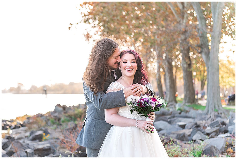 Portraits water rock jetty trees fall first look at bristol Warf Andalusia PA wedding park long hair groom purple hair heavy metal