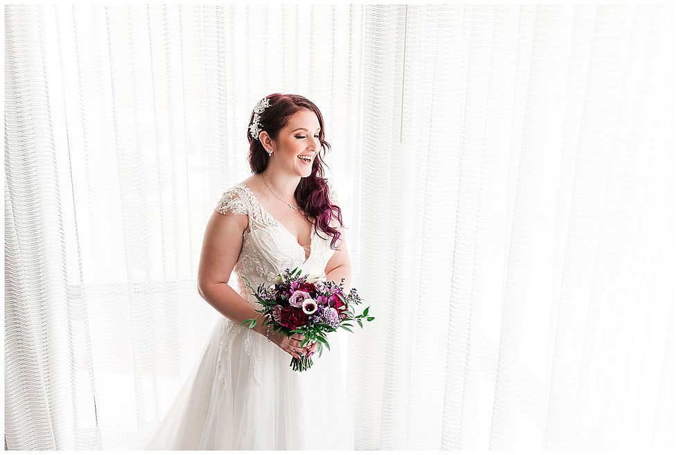Bride laughing holding bouquet Andalusia PA wedding