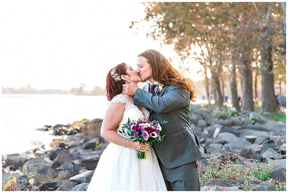Portraits water rock jetty trees fall first look at bristol Warf Andalusia PA wedding park long hair groom purple hair heavy metal