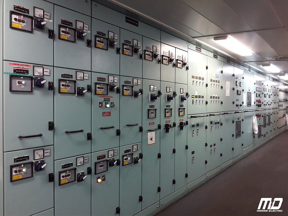 A long, well-lit marine electrical control panel installed by MD Marine Electric, featuring modern monitoring systems, switches, and labeled controls, ensuring efficient and safe vessel operations.
