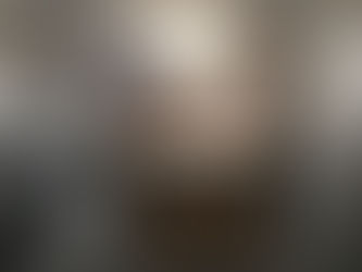 Family sorting laundry in bright home room