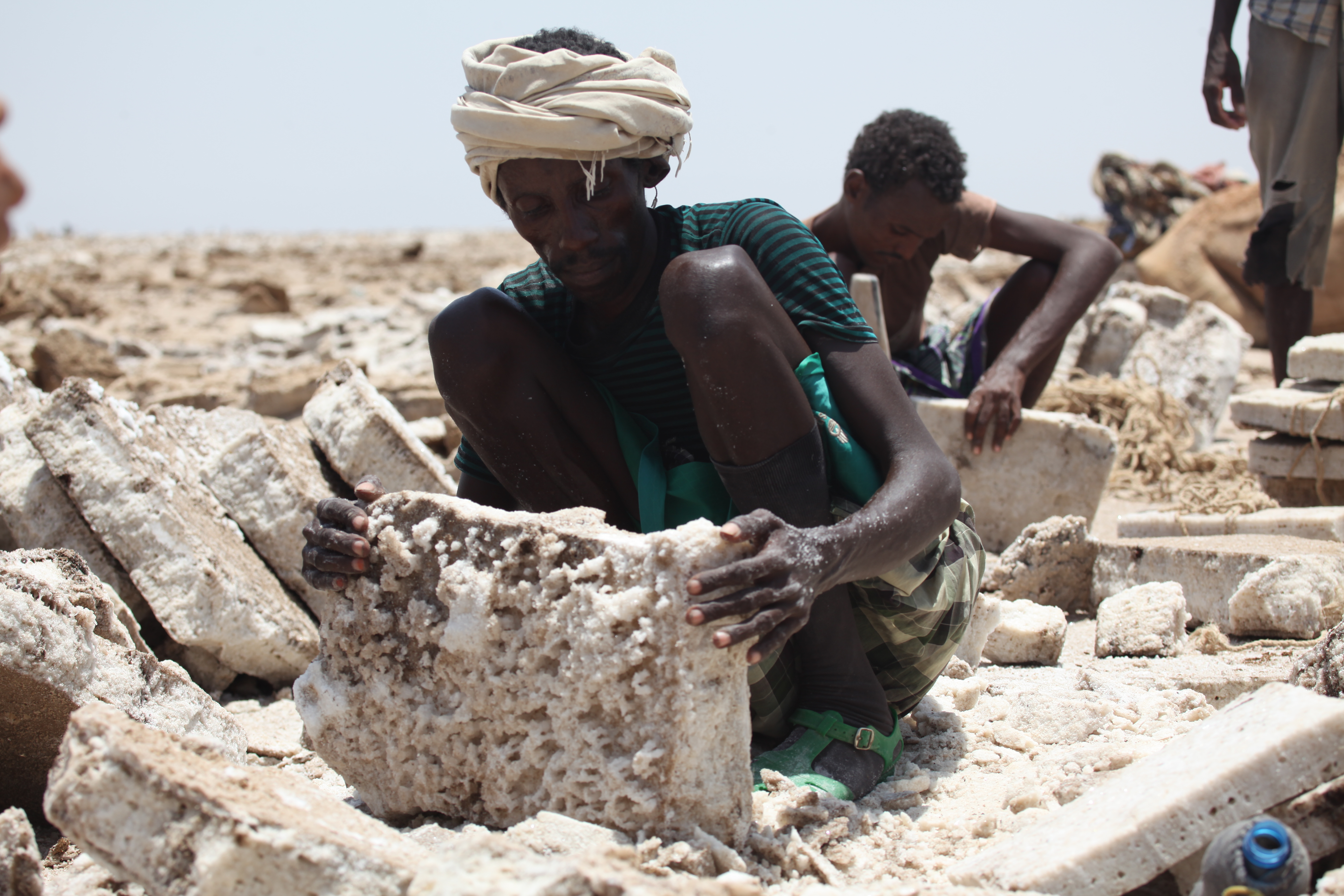 Afar, a man mining salt