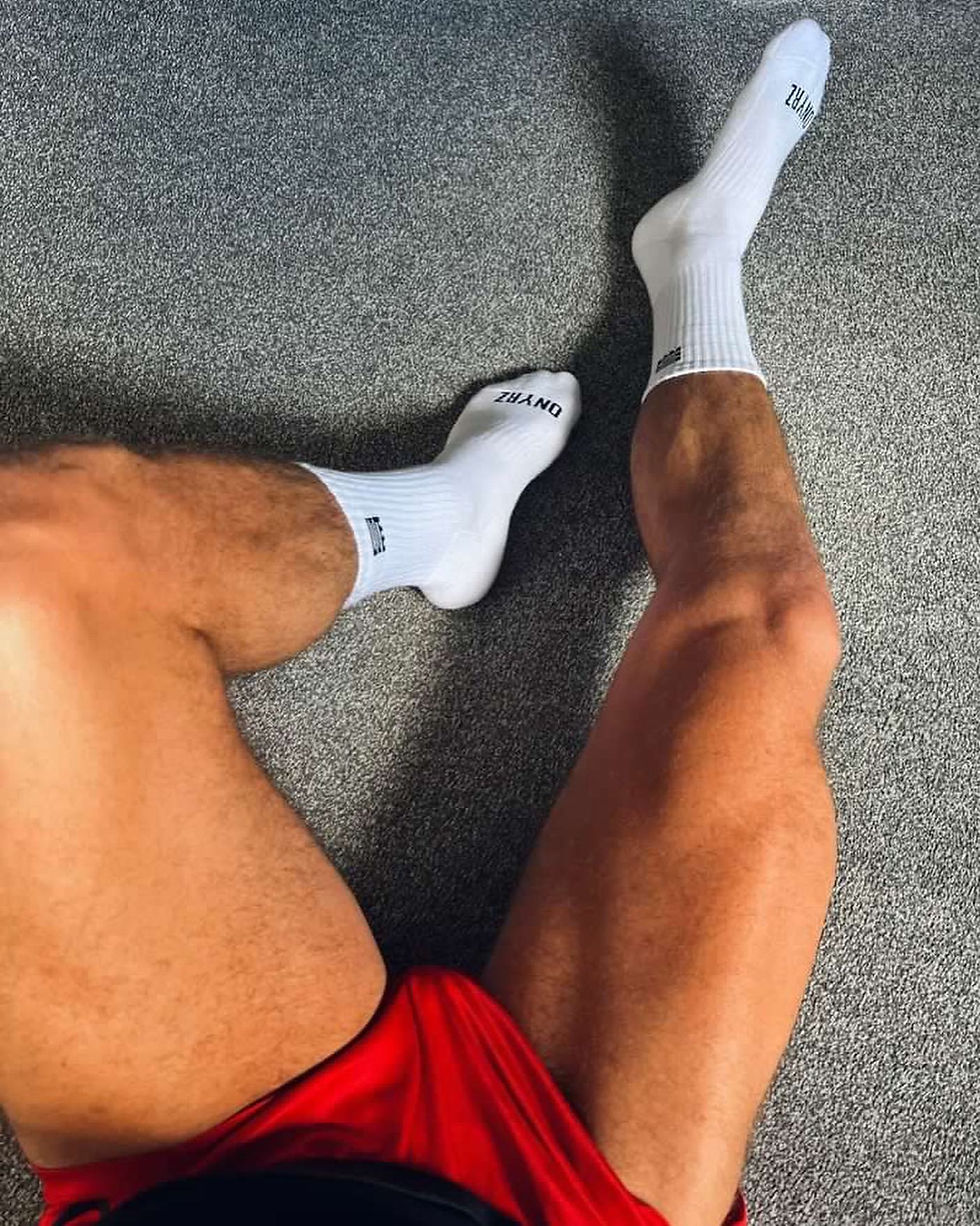 white sports crew socks muscular calves