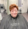 Woman showing new haircut at a hair salon in Toledo Ohio