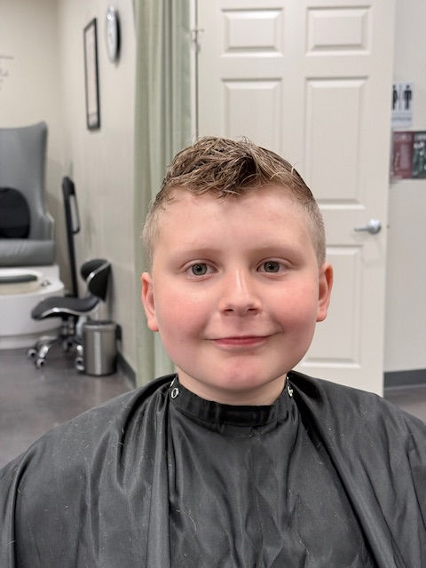 Boy with a fresh haircut at a Toledo, Ohio hair salon.