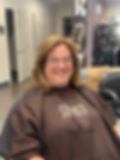 Smiling client at an independent beauty community hair salon in Toledo Ohio.