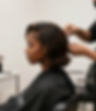 Stylist working at a hair salon booth suite in Toledo Ohio