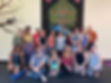Group photo of yoga students inside yoga studio