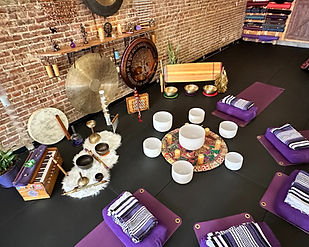 Aerial view of sound healing instruments set up for a sound bath at Black Cat Yoga