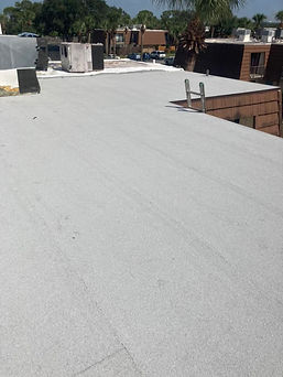 A completed commercial flat roof with many air conditioning units on it.