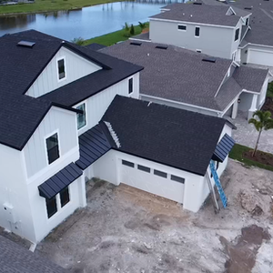 Completed shingle roof on a new construction home in Viera, Florida.