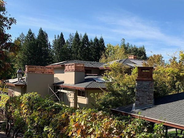 The final touch, copper chimney caps. Th