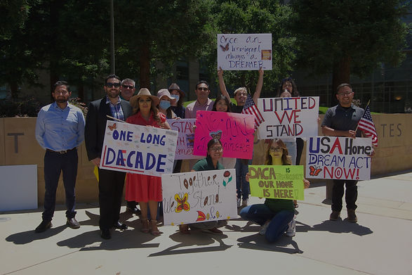 ELF Employees holding signs in support of DACA.