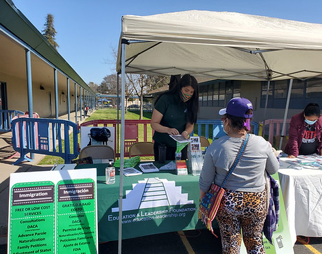 ELF Employees helping a client at the organization's stand.