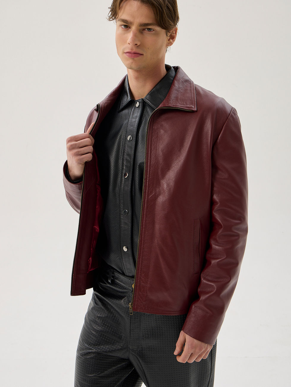 Burgundy sheepskin classic fit leather jacket with full zip front and vertical pockets