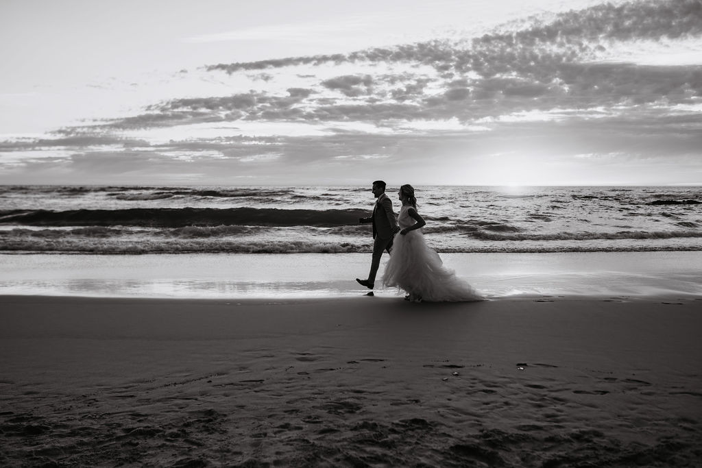 Black and white photograph of a couple on the beach