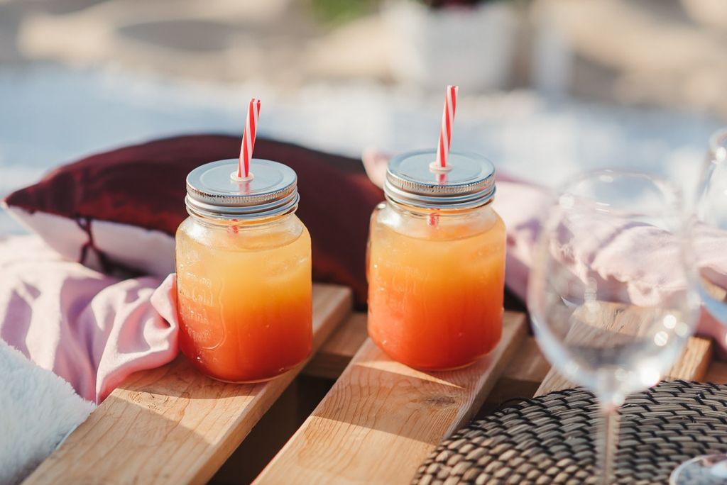 Two orange drinks at an Algarve celebration