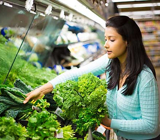 young-girl-choosing-leafy-vegetables.jpg