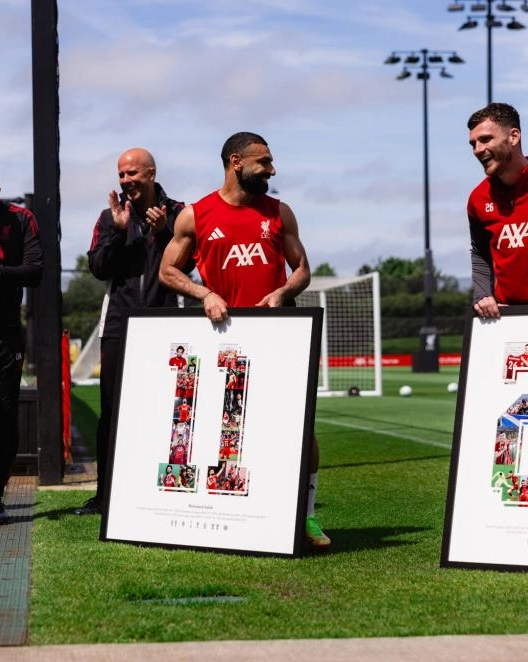 Reds squad present framed mementos to Andy Robertson and Mo Salah