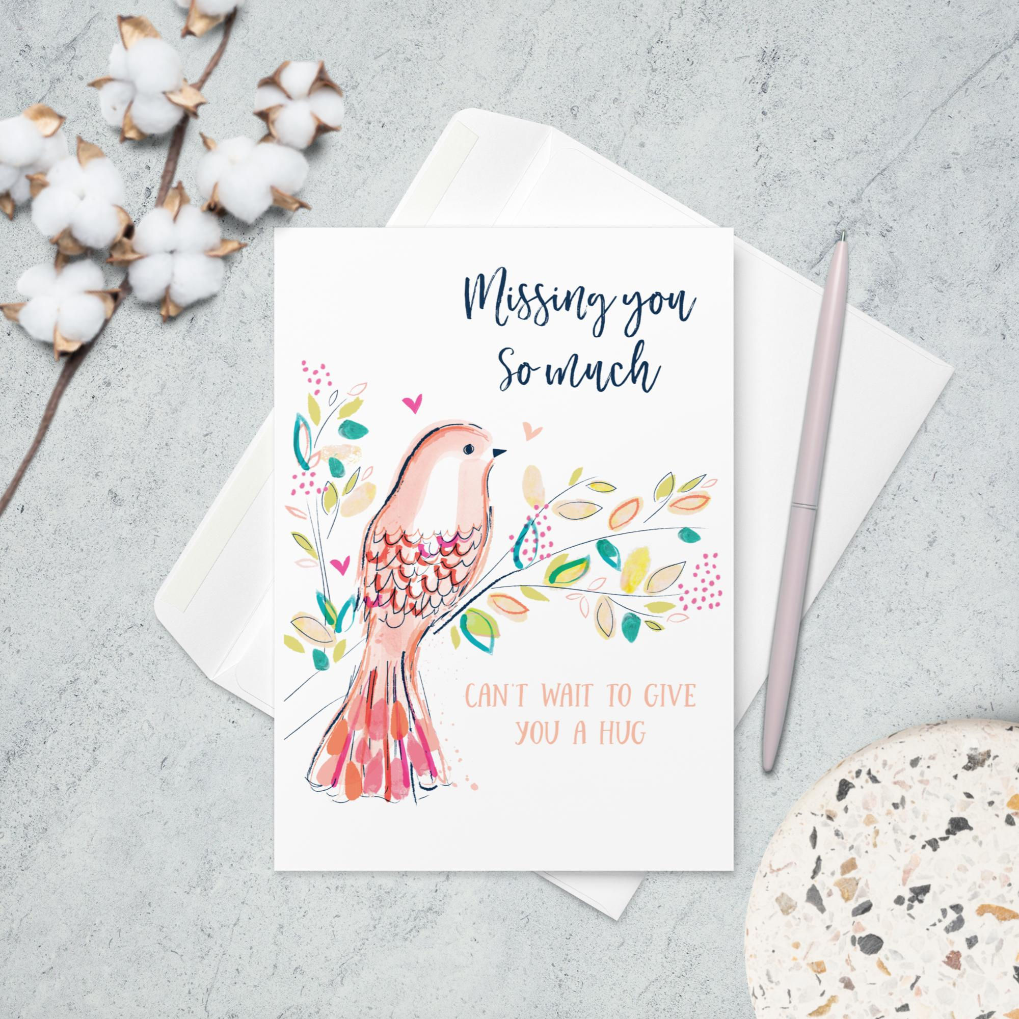 "Missing you So much CAN'T WAIT TO GIVE YOU A HUG" card with a tenderly illustrated bird amidst a flourish of leaves.