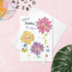 Colorful Daisy Birthday Card with Ladybug and Bee Illustrations on a tabletop