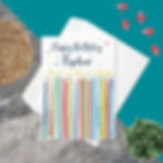 "Happy Birthday Nephew" card with a row of colorful, festive candles, on a white background, paired with a white envelope.