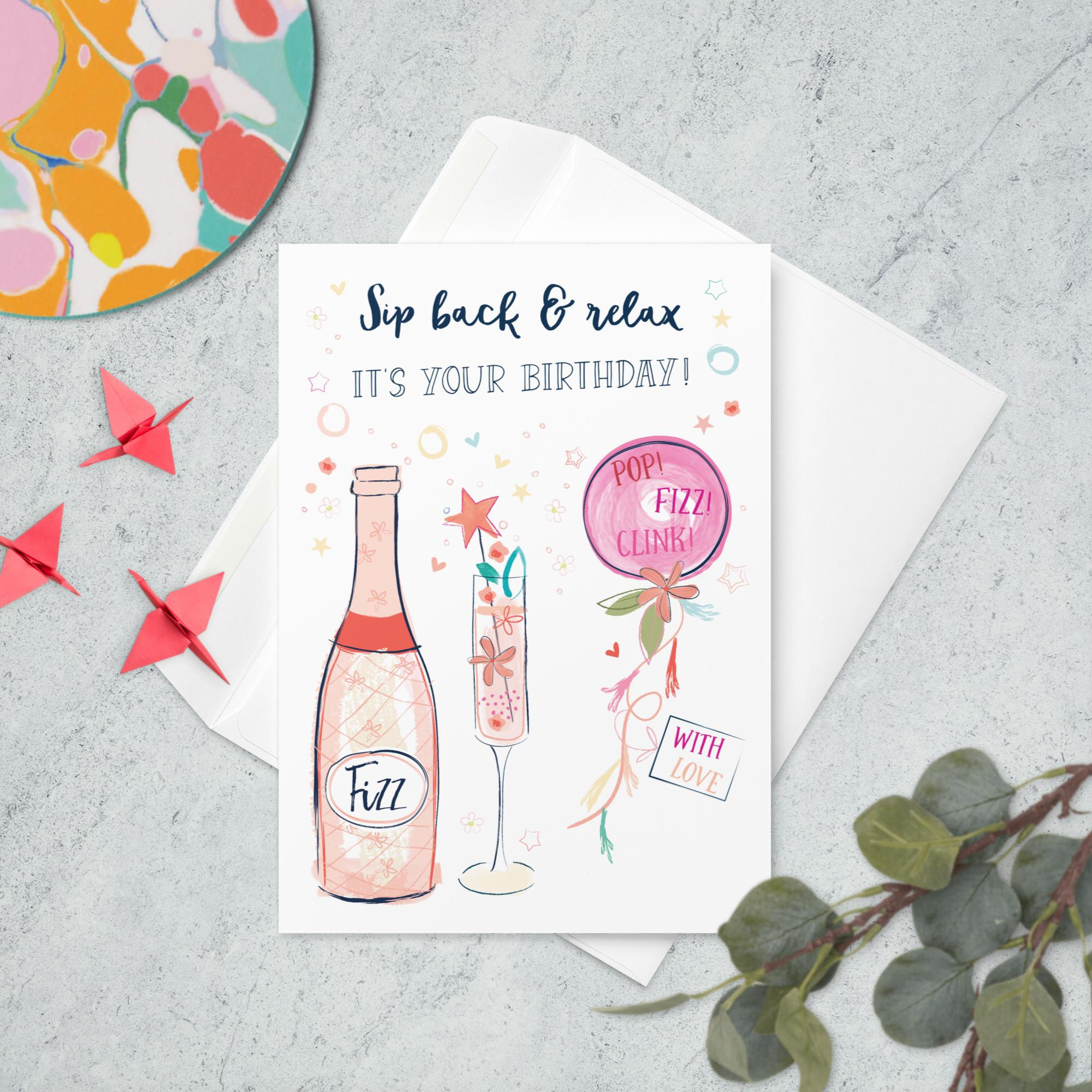 Champagne bottle and glass illustration with 'Sip back & relax IT'S YOUR BIRTHDAY!' message, and 'POP! FIZZ! CLINK!'