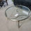 Thumbnail: Round coffee table metal with brass accent glass top